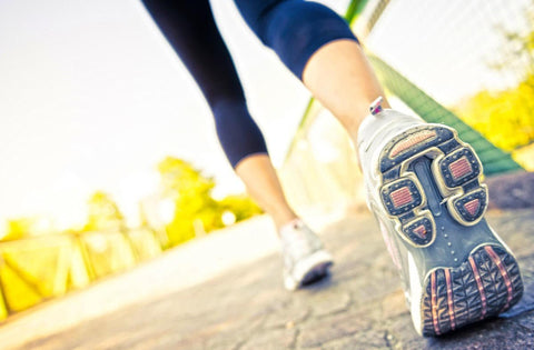Close-up of a person running on a path